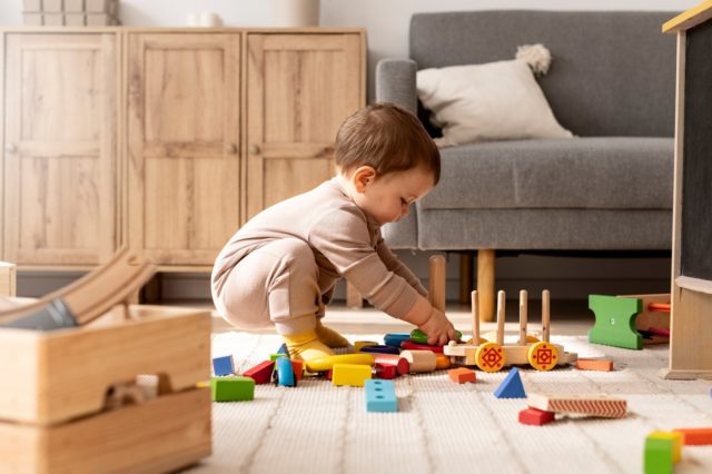 full shot child playing with colorful toys 23 2149357268